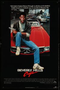 2043UF BEVERLY HILLS COP 1sh '84 great image of cop Eddie Murphy as Axel Foley sitting on Mercedes!