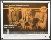 1c322 BRUBAKER half-sheet '80 warden Robert Redford is the most wanted man in Wakefield prison!