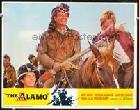 1w062 ALAMO lobby card #6 R67 great smiling image of John Wayne as Davy Crockett with coonskin hat!