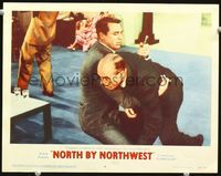 1w008 NORTH BY NORTHWEST lobby card #4 '59 Alfred Hitchcock, Cary Grant grabs knife in stabbed man!