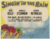 1y002 SINGIN' IN THE RAIN photolobby TC '52 Gene Kelly,Donald O'Connor,Debbie Reynolds w/umbrellas!