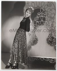 2d128 JOAN FONTAINE 7.5x9.25 still '40s great full-length image in unusual dress by wrought iron!