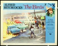 2n079 BIRDS lobby card #8 '63 Alfred Hitchcock, villagers use fire hoses to stop cars from burning!