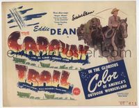 3b049 CARAVAN TRAIL title lobby card '46 by Eddie Dean, who is on horseback leading a wagon train!