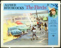 4c072 BIRDS lobby card #8 '63 Alfred Hitchcock, villagers use fire hoses to stop cars from burning!