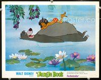4c369 JUNGLE BOOK lobby card '67 Disney cartoon classic, Mowgli floats on Baloo's belly on river!