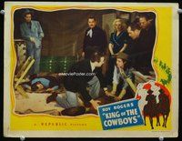 4c384 KING OF THE COWBOYS movie lobby card '43 great image of Roy Rogers out cold on the ground!