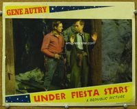 4c905 UNDER FIESTA STARS movie lobby card '41 great image of cowboy Gene Autry dis-arming bad guy!