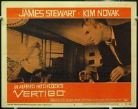 4c924 VERTIGO lobby card #8 '58 Alfred Hitchcock, standing James Stewart glares at blonde Kim Novak!