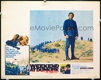 4c948 WEEKEND AT DUNKIRK movie lobby card '65 soldier Jean-Paul Belmondo stands alone!