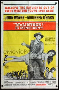 4h665 McLINTOCK 1sh '63 best image of John Wayne giving Maureen O'Hara a spanking!