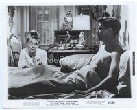 5j077 BREAKFAST AT TIFFANY'S 8x10.25 still '61 Audrey Hepburn smoking by barechested Peppard in bed