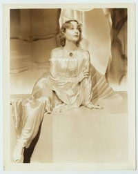 5j093 CAROLE LOMBARD 8x10 still '30s full-length in sexy shimmering gown seated on platform!