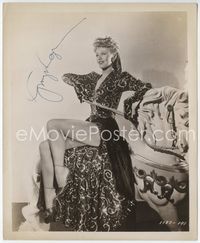 5j004 GINGER ROGERS signed 8x10 still '44 wearing super sexy outfit on wooden horse & showing legs!