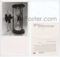 5j590 TONIGHT SHOW TV 7x9 still '80 full-length image of Johnny Carson standing by huge hourglass!