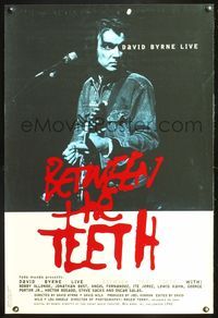 5m144 BETWEEN THE TEETH 1sh '94 cool image of David Byrne playing guitar live!