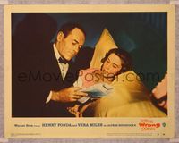 6f796 WRONG MAN LC #2 '57 c/u of Henry Fonda in tuxedo reading newspaper with Vera Miles, Hitchcock