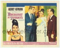 7r186 BREAKFAST AT TIFFANY'S LC #5 '61 George Peppard shows book to elegant Audrey Hepburn!