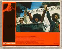 7r194 BROTHERS LC #2 '77 Vonetta McGee raises arms at protest rally, Saul Bass border art!