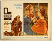 7r599 ONE EYED JACKS LC #3 '61 Pina Pellicer holds Marlon Brando's hands through prison bars!
