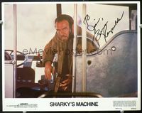 7r697 SHARKY'S MACHINE signed LC #1 '81 by Burt Reynolds, who getting onto a bus with a gun!