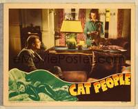 8b065 CAT PEOPLE  LC '42 Tourneur, Kent Smith on couch looks at sexy Simone Simon behind desk!