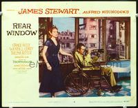 9k395 REAR WINDOW LC #6 '54 Alfred Hitchcock, great image of Grace Kelly & James Stewart with lens!