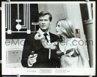 2y691 MAN WITH THE GOLDEN GUN 1 '74 8x10 still & 1 R82 8x10 still, Moore as James Bond!