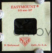 3b400 CLINT EASTWOOD/ROGER MOORE 2 35mm slides '70s Eastwood as Dirty Harry & Moore as Bond!