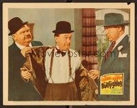 6d202 BULLFIGHTERS LC '45 Oliver Hardy removes Stan Laurel's coat as Ralph Sanford threatens them.