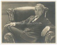 7c023 CHARLIE CHAPLIN signed deluxe 7.25x9.25 still '40s seated portrait with legs over chair arm!