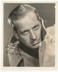 7c113 MELVYN DOUGLAS signed 8x10 still '37 close portrait in overcoat from I'll Take Romance!