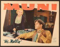 7s428 HI NELLIE LC '34 Glenda Farrell sits on newspaper man Paul Muni's desk as he holds pipe!