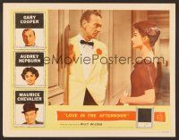 7s483 LOVE IN THE AFTERNOON LC '57 Gary Cooper looks sadly at beautiful young Audrey Hepburn!