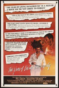 8k684 YEAR OF LIVING DANGEROUSLY reviews 1sh '83 Peter Weir, great artwork of Mel Gibson!