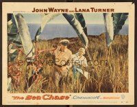 8t622 SEA CHASE LC #1 '55 John Wayne & Lana Turner walking through high grass on an island!