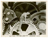 8w496 MODERN TIMES 8x10 still R59 classic image of Charlie Chaplin playing on giant gears!