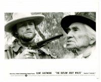 8w530 OUTLAW JOSEY WALES 8x10 still '76 c/u of Clint Eastwood holding gun to Chief Dan George!