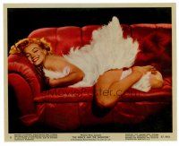 8w048 PRINCE & THE SHOWGIRL color 8x10 still #8 '57 sexy Marilyn Monroe smiling on couch in feathers