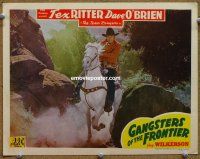 9b311 GANGSTERS OF THE FRONTIER LC '44 close up of Tex Ritter on his horse aiming his gun!