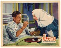 9b012 I STAND CONDEMNED LC '36 close up of sick Laurence Olivier feeding soup to his nun nurse!