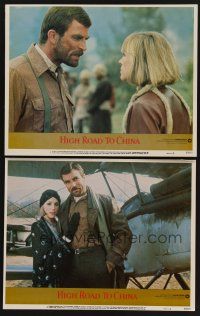 9c783 HIGH ROAD TO CHINA 2 LCs '83 images of aviator Tom Selleck & Bess Armstrong!