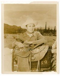 9j271 GENE AUTRY 8x10 still '40s standing by his saddle outdoors in cowboy outfit!