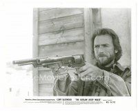 9j516 OUTLAW JOSEY WALES 8x10 still '76 close up of Clint Eastwood pointing two giant guns!