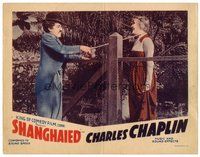 1x897 SHANGHAIED LC R40 Tramp Charlie Chaplin romances rich woman across gate with his cane!
