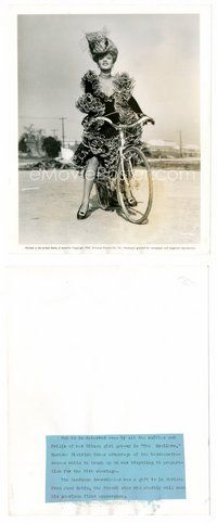 2a410 MARLENE DIETRICH candid 8x10 still '42 riding bicycle in dress between scenes from Spoilers!