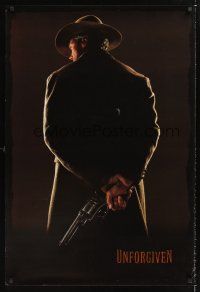 2y761 UNFORGIVEN undated teaser 1sh '92 image of gunslinger Clint Eastwood with his back turned!
