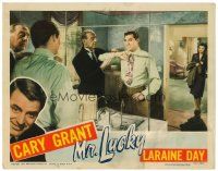 3h576 MR. LUCKY LC '43 Laraine Day watches dapper gambler Cary Grant get dressed!