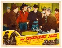 3h791 THUNDERING TRAIL LC #7 '51 Lash La Rue & cowboys gathered around man with arm in a sling!