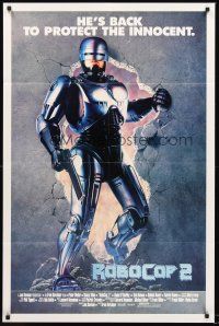 3s679 ROBOCOP 2 int'l 1sh '90 cyborg policeman Peter Weller busts through wall, scii-fi sequel!